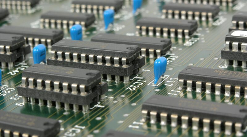Detailed macro shot showcasing integrated circuits and components on electronic motherboard.