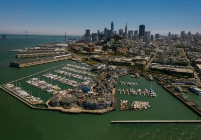Stunning aerial shot of San Francisco's marina with city skyline in the background, showcasing the bay area.