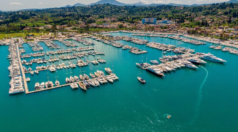 Stunning aerial photograph of Gouvia Marina, showcasing yachts and scenic landscape in Greece.