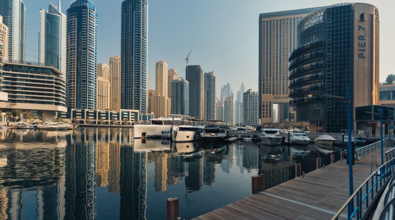 Explore the breathtaking skyline of Dubai Marina with iconic skyscrapers and luxury yachts.