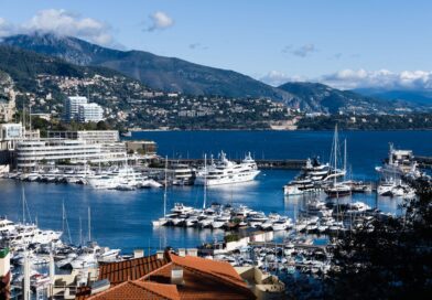 Breathtaking view of Monaco marina with luxurious yachts and scenic backdrop.